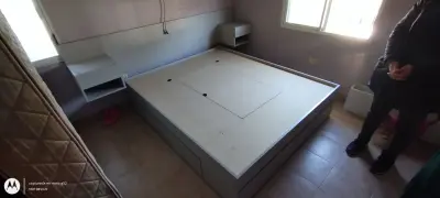 Cama box con respaldo y mesas de luz con 6 cajones y 3 bauleras 