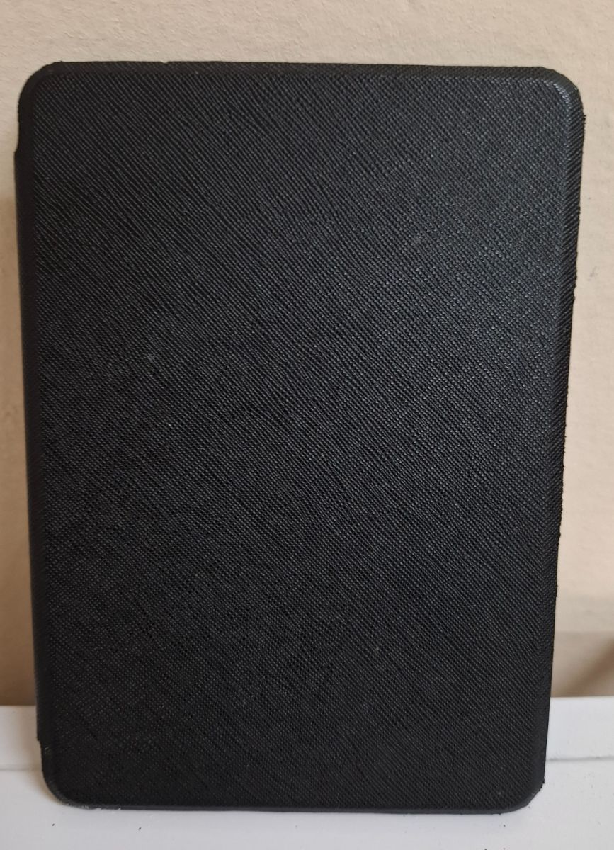 Kindle Paperwrite 10ma. generación negro con funda de encendido automático color negro..